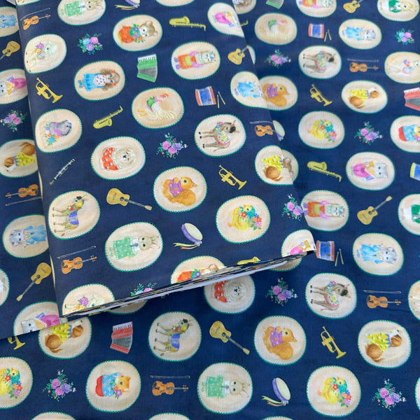 Bolt of Bon Bon Journey Cotton Lawn Fabric in Navy by Yukiemon for Hokkoh featuring whimsical travel-themed illustrations on soft Japanese cotton lawn.