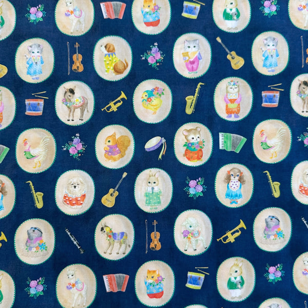 Bon Bon Journey Cotton Lawn Fabric in Navy by Yukiemon for Hokkoh featuring whimsical travel-themed illustrations on soft Japanese cotton lawn.
