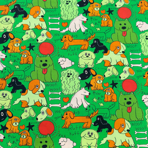 Bow Wow Pop! cotton fabric in green by Nora featuring playful dogs on a green background, imported from Japan