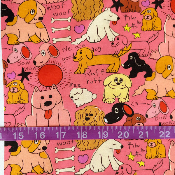 Scale of Bow Wow Pop cotton fabric by Nora featuring playful illustrated dogs in a hand-drawn style on a bright pink background, imported from Japan