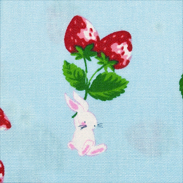 Close up of Bunnies and Strawberries cotton fabric by Cosmo Textiles in blue and red, SP2600 1C