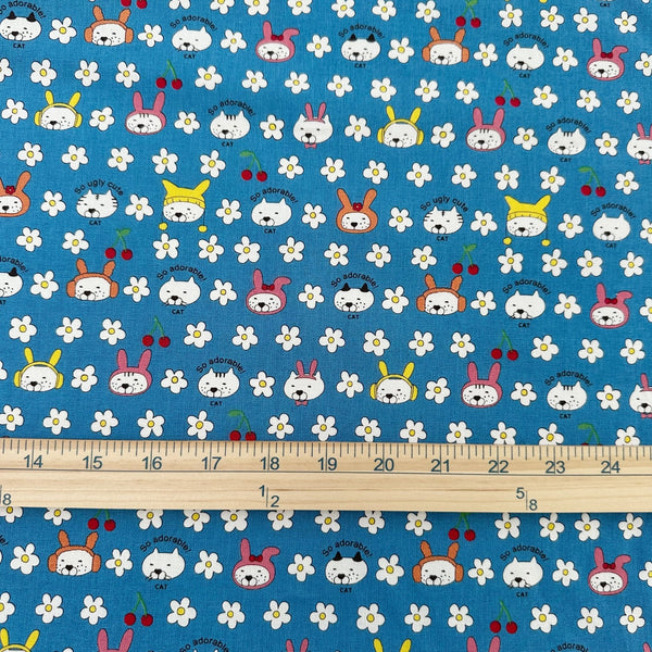 Scale of Bunny Cat cotton canvas fabric by Cotton Kobayashi in blue