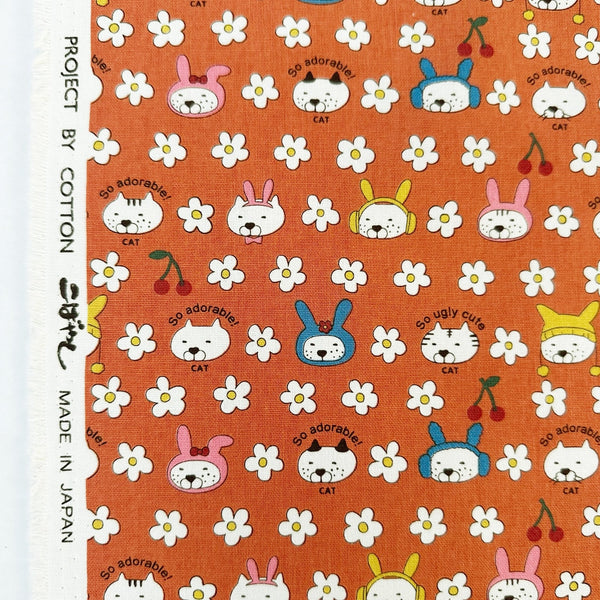 Selvage of Bunny Cat cotton canvas fabric by Cotton Kobayashi in orange