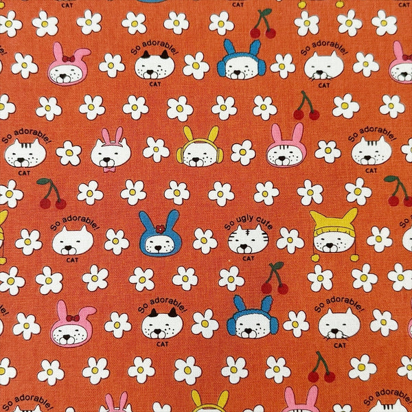 Bunny Cat cotton canvas fabric by Cotton Kobayashi in orange
