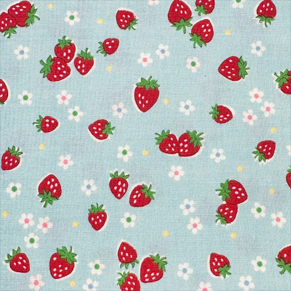 Close-up of Candy Berry blue cotton fabric with strawberry print from Atsuko Matsuyama Yuwa 30’s Collection, perfect for quilting and crafts.