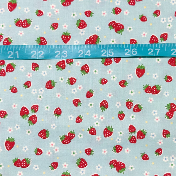 Scale of Candy Berry blue cotton fabric with strawberry print from Atsuko Matsuyama Yuwa 30’s Collection, perfect for quilting and crafts.