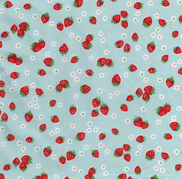 Zoom out of Candy Berry blue cotton fabric with strawberry print from Atsuko Matsuyama Yuwa 30’s Collection, perfect for quilting and crafts.