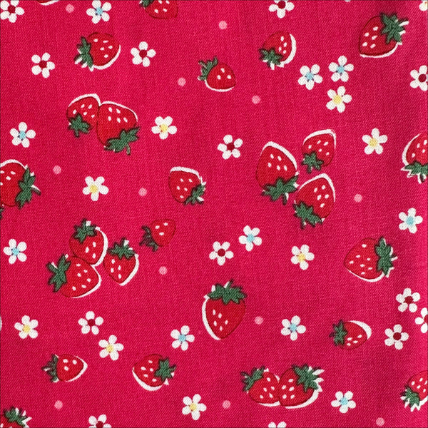 Close-up of Candy Berry Red cotton fabric with strawberry print from Atsuko Matsuyama Yuwa 30’s Collection, perfect for quilting and crafts.