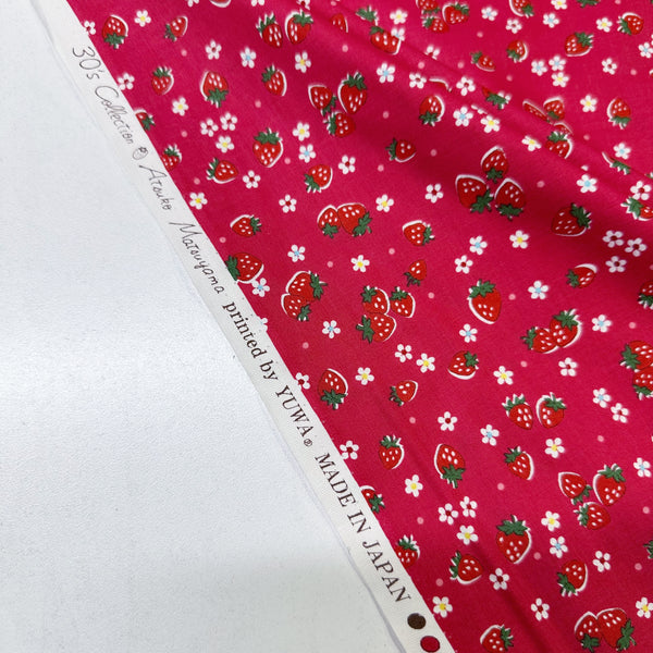 Selvage of Candy Berry red cotton fabric with strawberry print from Atsuko Matsuyama Yuwa 30’s Collection, perfect for quilting and crafts.