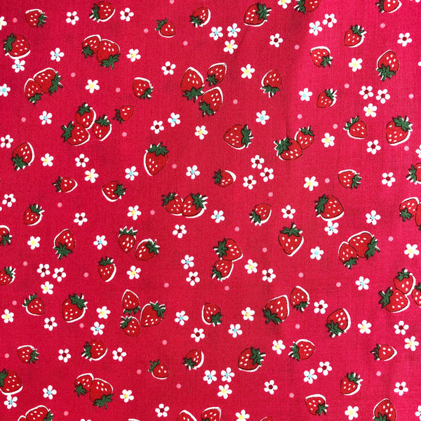 Zoom out of Candy Berry red cotton fabric with strawberry print from Atsuko Matsuyama Yuwa 30’s Collection, perfect for quilting and crafts.