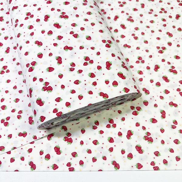 Bolt of Candy Berry white cotton fabric with strawberry print from Atsuko Matsuyama Yuwa 30’s Collection, perfect for quilting and crafts.