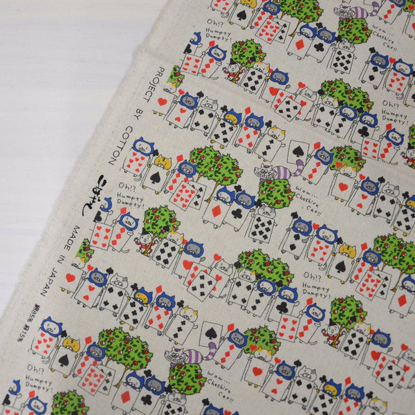 Selvage of Card Guard Cats canvas fabric in natural featuring cats dressed as playing card guards by Cotton Kobayashi
