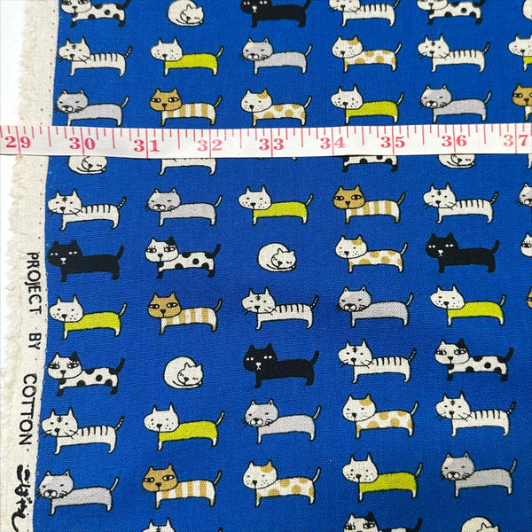 Scale of Cat Parade blue canvas fabric by Cotton Kobayashi, cotton linen blend with cat print