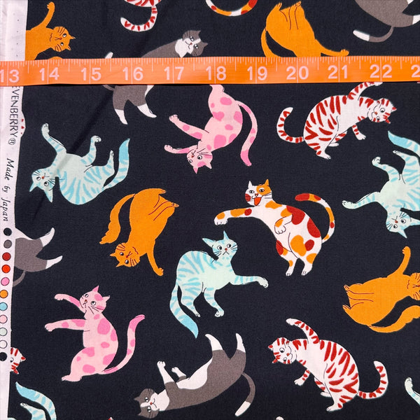 Scale of Cat Punch cotton broadcloth fabric in black by Sevenberry, Japanese import featuring playful cat print