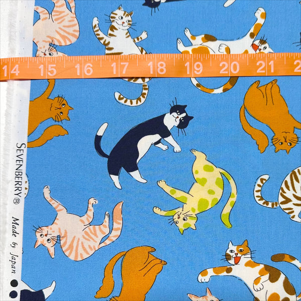 Scale of Cat Punch cotton broadcloth fabric in blue by Sevenberry, Japanese import featuring playful cat print