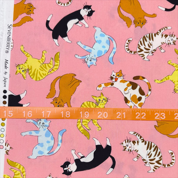 Scale of Cat Punch cotton broadcloth fabric in pink by Sevenberry, Japanese import featuring playful cat print