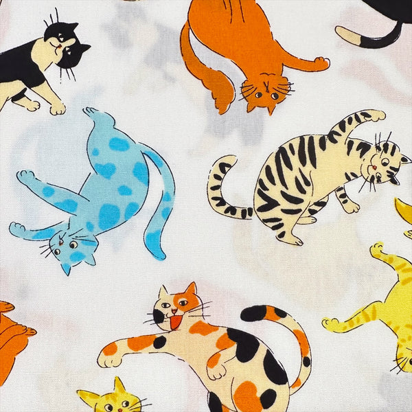 Close up of Cat Punch cotton broadcloth fabric in white by Sevenberry, Japanese import featuring playful cat print