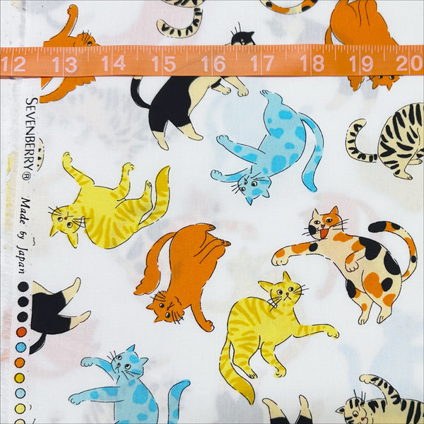 Scale of Cat Punch cotton broadcloth fabric in white by Sevenberry, Japanese import featuring playful cat print