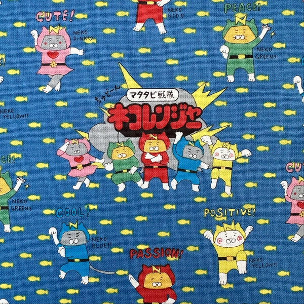 Close up of Cat Ranger cotton canvas fabric by Cotton Kobayashi in blue
