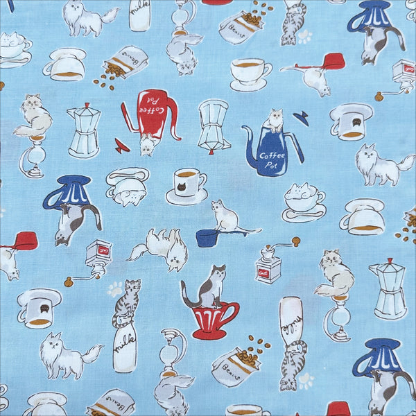 Cat and Coffee cotton fabric by Handworks featuring playful cats and coffee-themed illustrations on a blue background