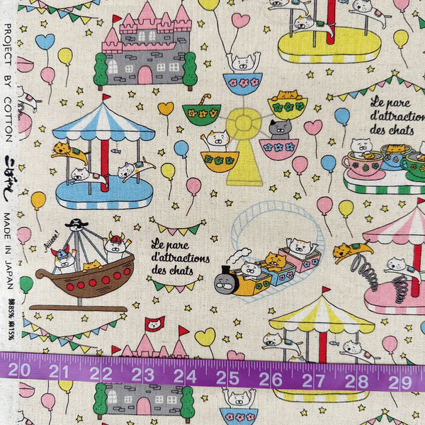 Scale of Catland Cotton Linen Canvas Fabric by Cotton Kobayashi, style KTS-7183A, featuring cats at an amusement park, in cream, imported from Japan