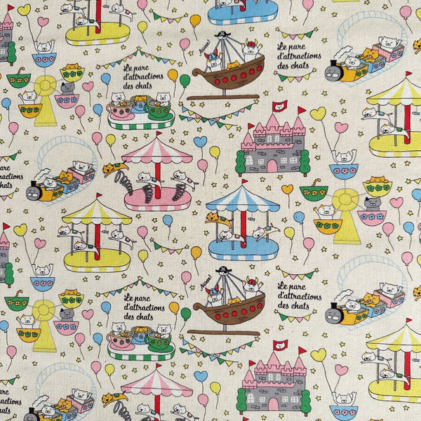 Catland Cotton Linen Canvas Fabric by Cotton Kobayashi, style KTS-7183A, featuring cats at an amusement park, in cream, imported from Japan