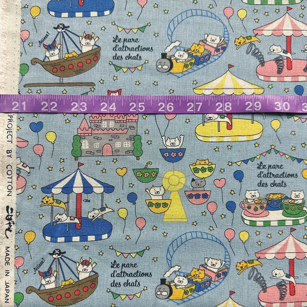 Scale of Catland Cotton Linen Canvas Fabric by Cotton Kobayashi, style KTS-7183C, featuring cats at an amusement park, in blue, imported from Japan