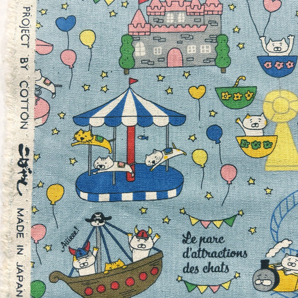 Selvage of Catland Cotton Linen Canvas Fabric by Cotton Kobayashi, style KTS-7183C, featuring cats at an amusement park, in blue, imported from Japan