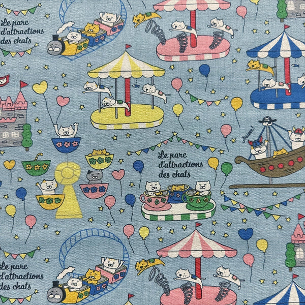 Catland Cotton Linen Canvas Fabric by Cotton Kobayashi, style KTS-7183C, featuring cats at an amusement park, in blue, imported from Japan