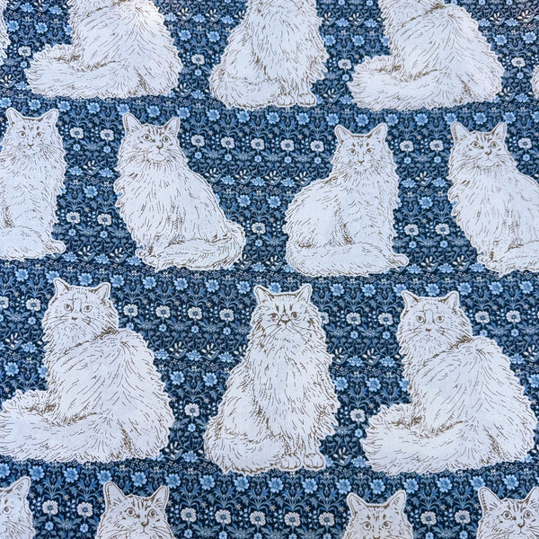 Cats Playground cotton fabric in blue by Handworks Japan featuring large-scale cats on a petite floral background