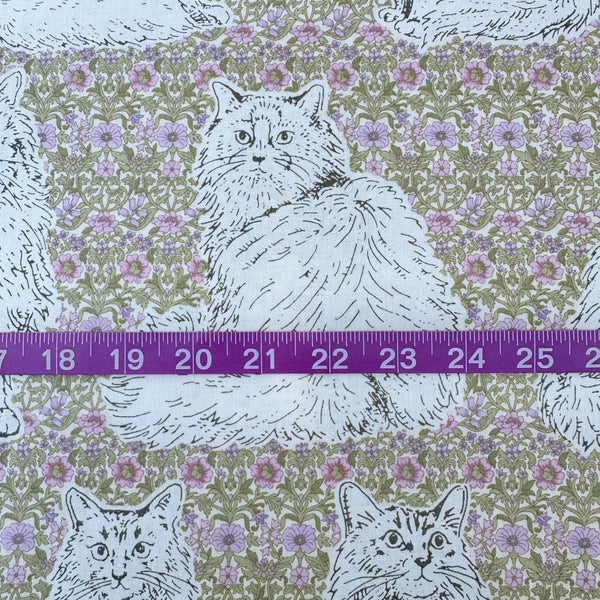 Scale of Cats Playground cotton fabric in green and purple by Handworks Japan featuring large-scale cats on a petite floral background