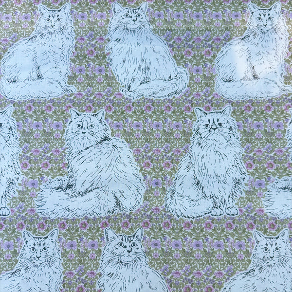 Cats Playground cotton fabric in green and purple by Handworks Japan featuring large-scale cats on a petite floral background