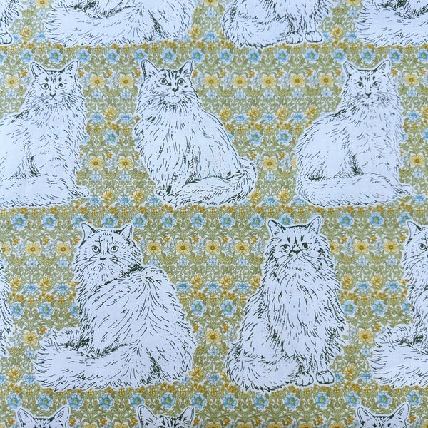 Cats Playground cotton fabric in green and yellow by Handworks Japan featuring large-scale cats on a petite floral background