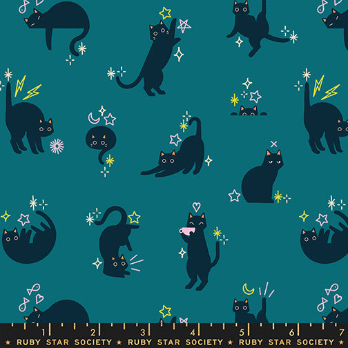 Scale of Catwalk cotton fabric by Ruby Star Society featuring cats and stars scattered across a teal background.