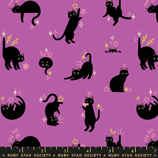 Scale of Catwalk cotton fabric by Ruby Star Society featuring cats and stars scattered across an orchid purple background.