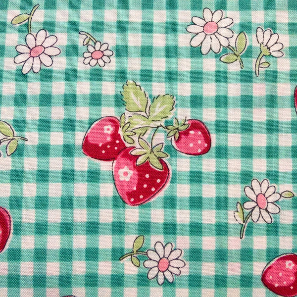 CLose up of Check and Strawberry cotton fabric by Yuwa in green, AT829949 D