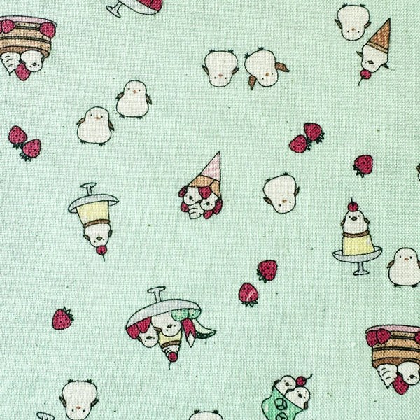 Close up of Chibi Puri Shimaenaga cotton fabric by Kokka in pale mint, style YKA-39050 2C
