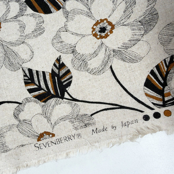 Selvage of Climbing Camellia cotton linen canvas fabric by Sevenberry in natural