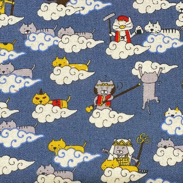 Close up of Cloud Cats canvas fabric in steel cotton linen blend by Cotton Kobayashi featuring silly cats hanging out in clouds