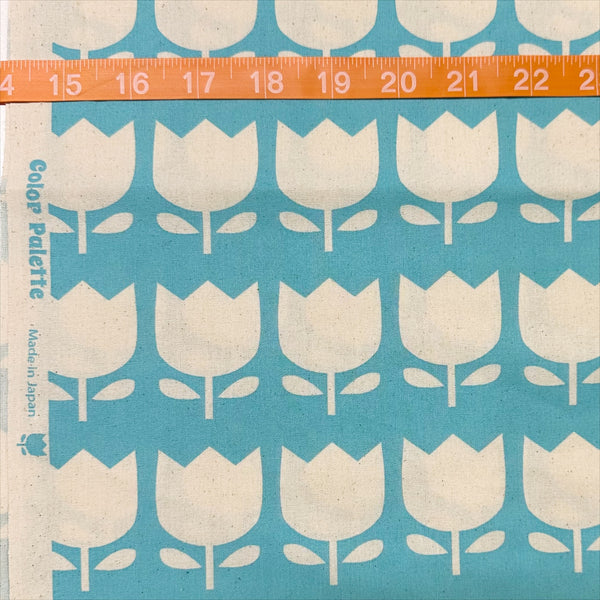 Scale of Color Palette Tulips cotton fabric in blue, Japanese import with cheerful tulip print on blue background
