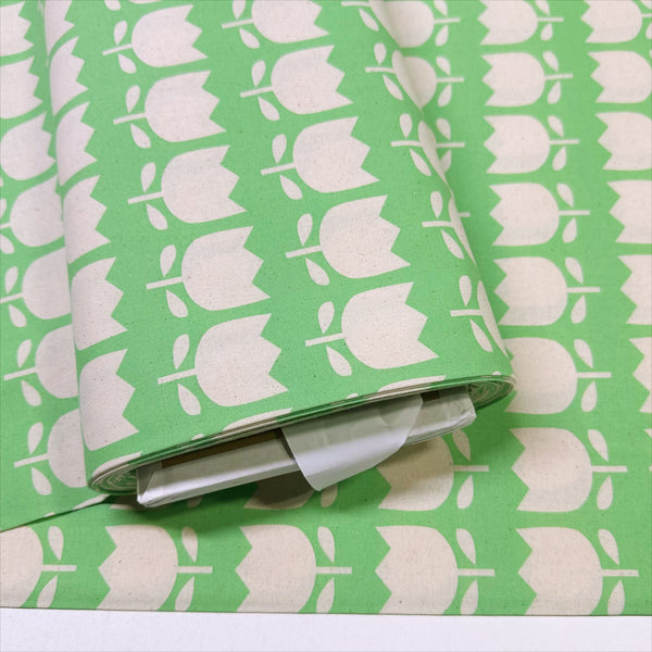 Bolt of Color Palette Tulips cotton fabric in green, Japanese import with cheerful tulip print on green background