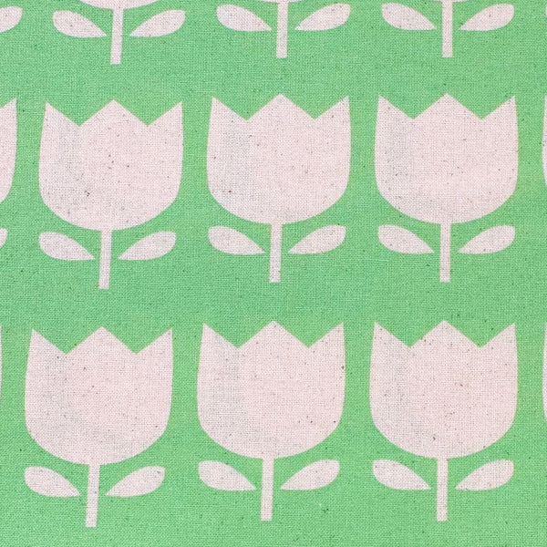 Close up of Color Palette Tulips cotton fabric in green, Japanese import with cheerful tulip print on green background