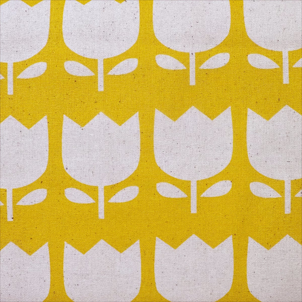 Close up of Color Palette Tulips cotton fabric in yellow, Japanese import with cheerful tulip print on yellow background