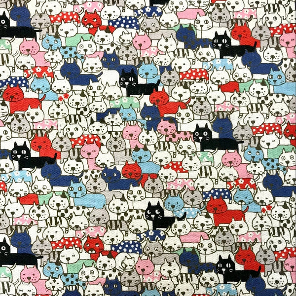 Compact Cats fabric in natural featuring a quirky, densely packed cat print by Cotton Kobayashi