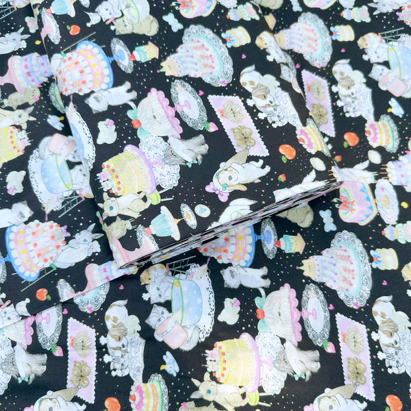 Bolt of Cook Cats cotton lawn fabric in black by Yukiemon for Hokkoh featuring adorable animals baking cakes and preparing sweet treats, imported from Japan