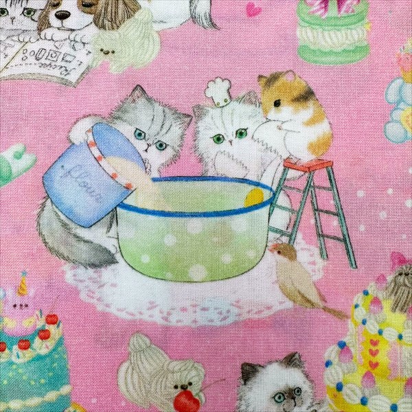 Close up of Cook Cats cotton lawn fabric by Yukiemon for Hokkoh featuring adorable animals baking cakes and preparing sweet treats, imported from Japan