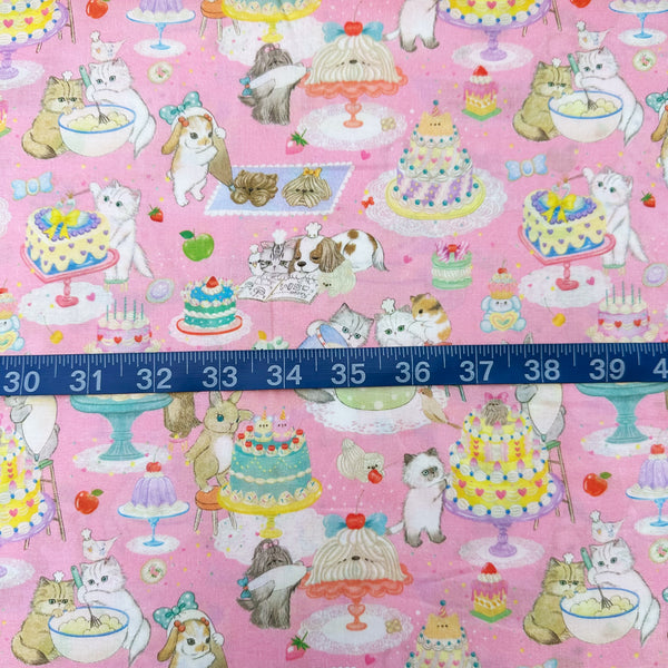 Scale of Cook Cats cotton lawn fabric by Yukiemon for Hokkoh featuring adorable animals baking cakes and preparing sweet treats, imported from Japan