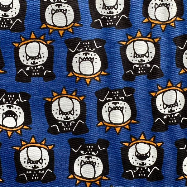 Close up of Bulldog Faces cotton oxford fabric in blue by Cosmo Textiles, Japanese import with playful bulldog face print
