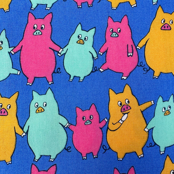 Close up of Dancing Pigs Cotton Broadcloth Fabric by Sevenberry, style B850618Z, featuring dancing pigs, in blue, imported from Japan