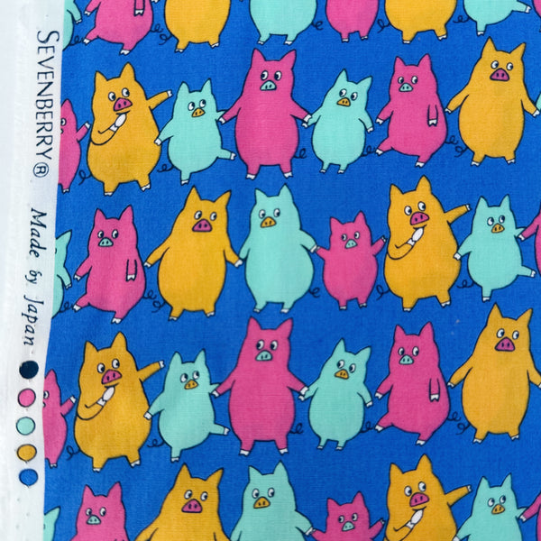 Selvage of Dancing Pigs Cotton Broadcloth Fabric by Sevenberry, style B850618Z, featuring dancing pigs, in blue, imported from Japan